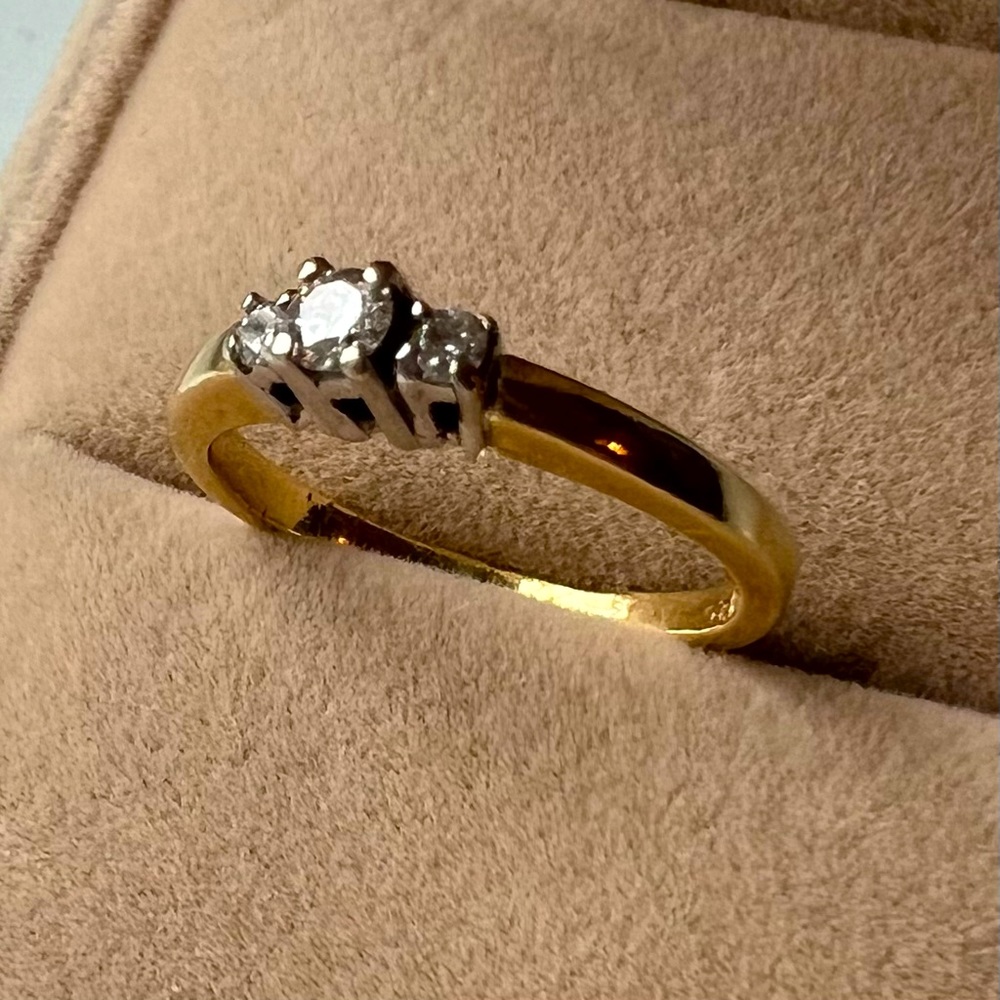 14k gold ring with three diamonds